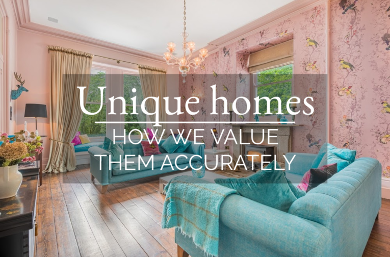 Lounge with teal sofas and pink bird wallpaper